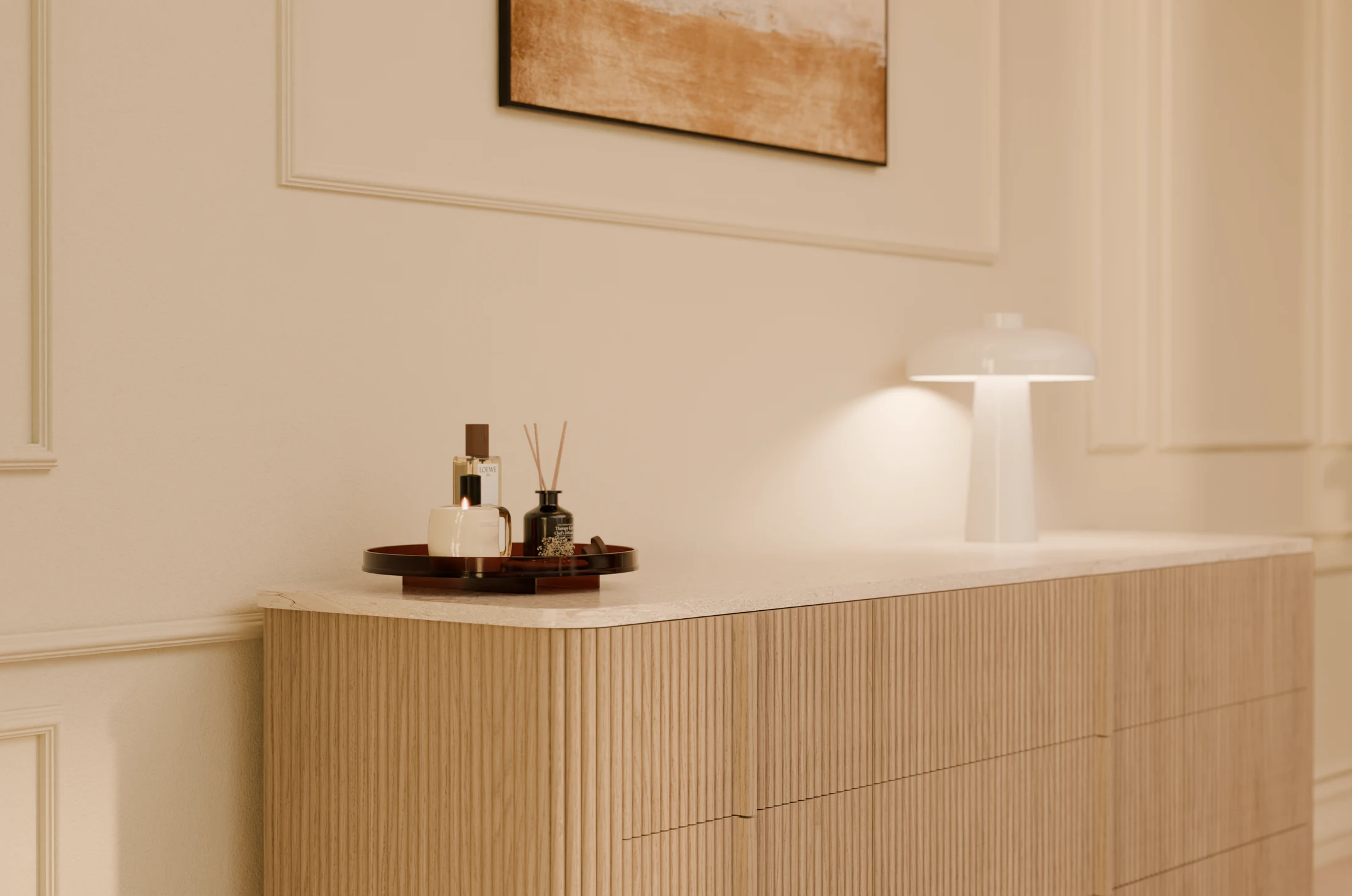 Curved timber dresser with a stone top and softly lit accessories
